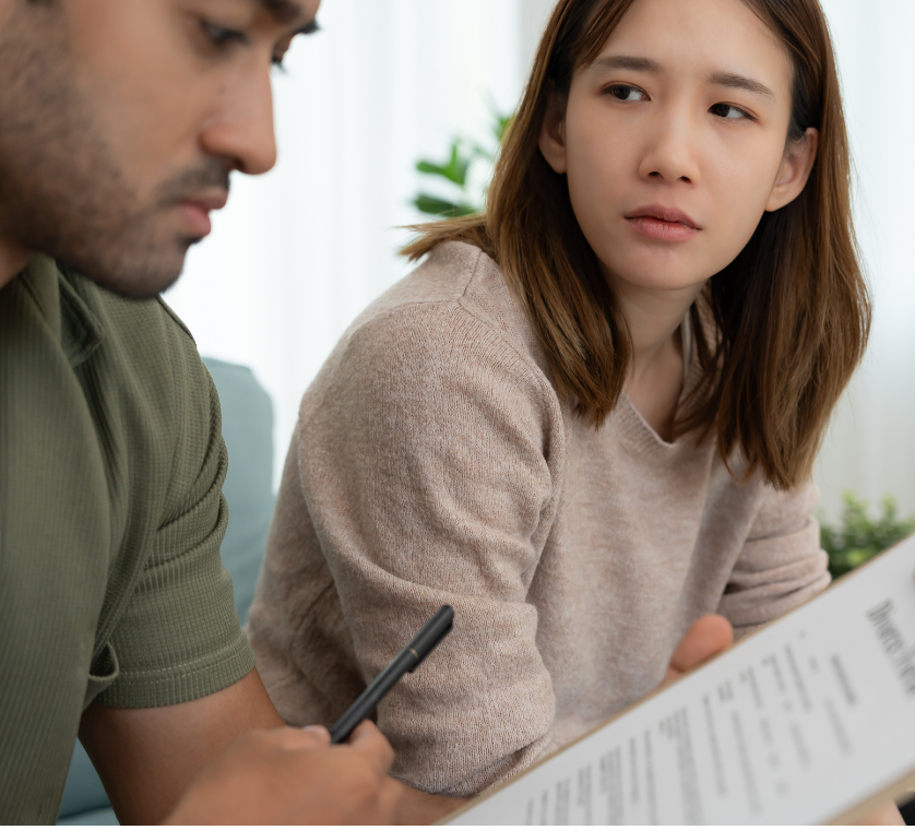 couple signing uncontested divorce papers