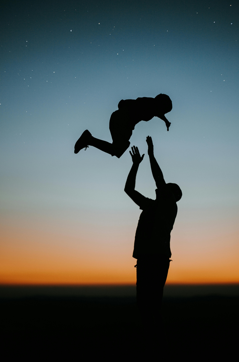 paternity father with child playing